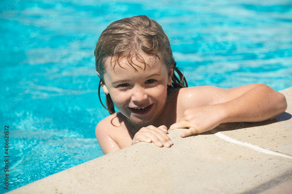 Wall mural portrait of child in summer swimming pool.