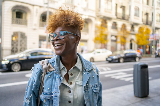 Happy Black Woman Standing On The Street.