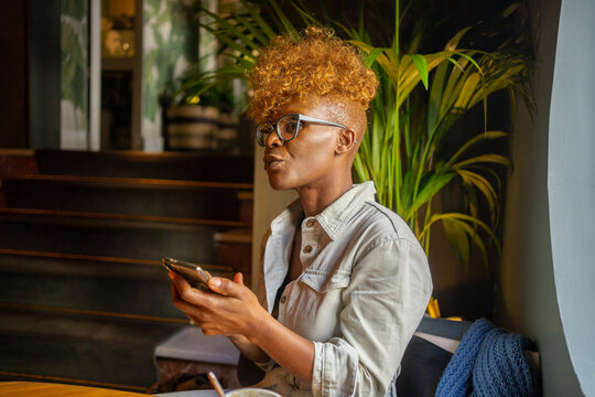 Black Woman Waiting In A Cafe.