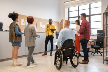 Coworkers Meeting In Modern Luminous Office 