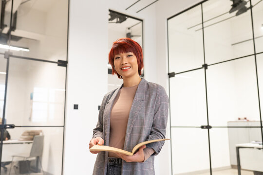 Smiling Asian Woman At Office