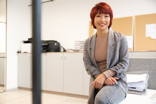 Informal Portrait Of Asian Woman At Office