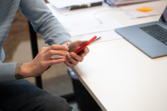 Anonymous Man Using Phone Indoors
