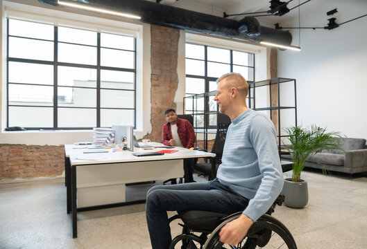 Man On Wheelchair At Office