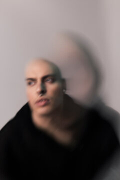 Blurred weird portrait of young man