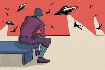 Man sitting on a bench watching an alien attack