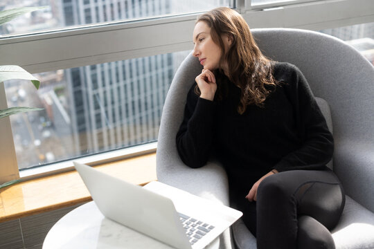 Woman looking out the window