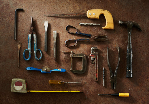 A Group of DIY Tools on Rust Background Shot from Above