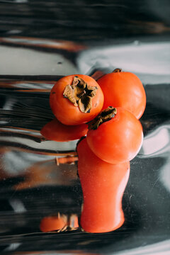 Persimmon still life.