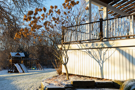 Light Dusting of winter snow on Swingset in backyard 