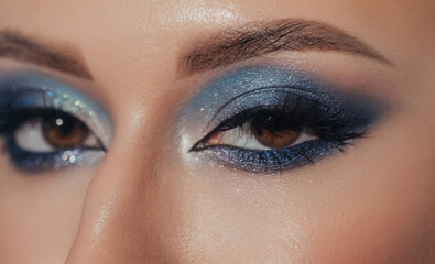 Crop woman with bright makeup looking at camera
