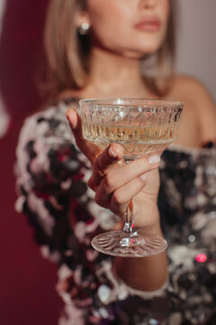 Woman with glass of champagne at party
