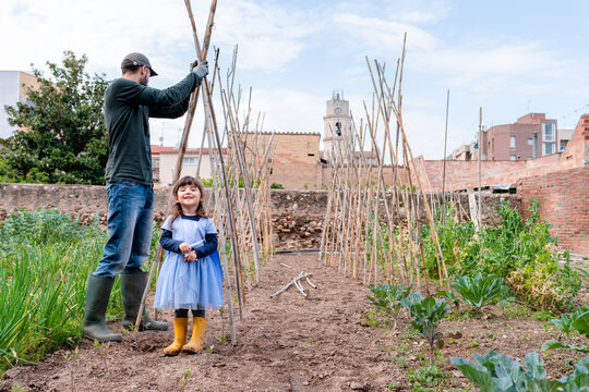 Daughter and father together in the garden