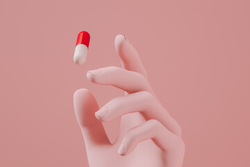 Hand picking up capsule pill 