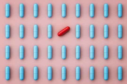 Top view of pills on pink background