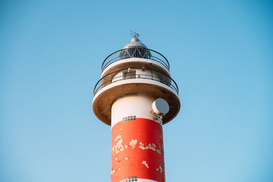 Beacon tower against blue sky