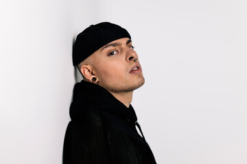 Stylish alternative young man in black jacket