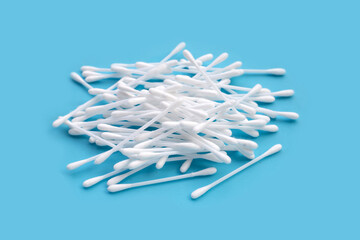 Cotton buds on blue background.