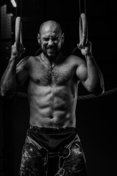 crossfit athlete close-up during heavy pull-ups