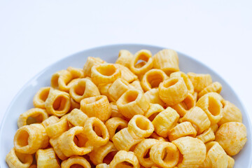 Crispy potato rings on white background.