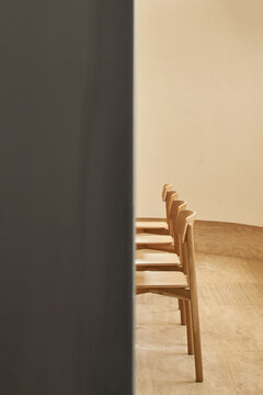 Perspective of chairs in sunlit room