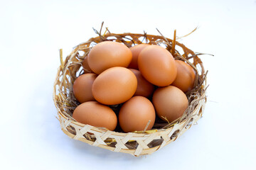 Fresh organic eggs in a straw nest