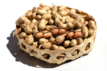 Raw peanuts in bamboo basket