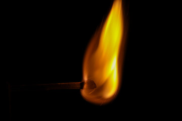 A close up of  a Match Stick in flames