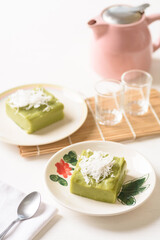 Pandanus pudding with coconut topping on white background, Traditional sweets that are cultural heritage of Asia.