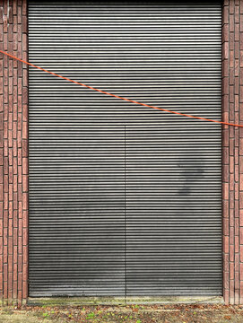 brick wall with metal shutter