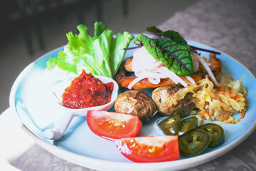 german sausages with vegetables and sauce