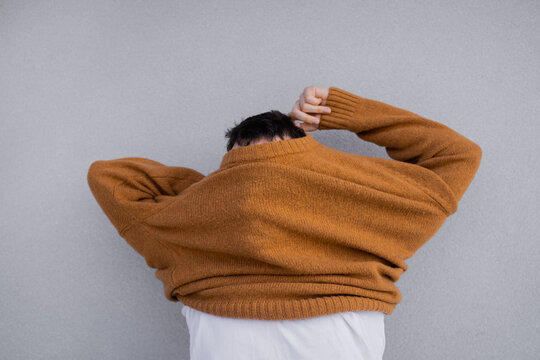 Pulling Sweater Over Head