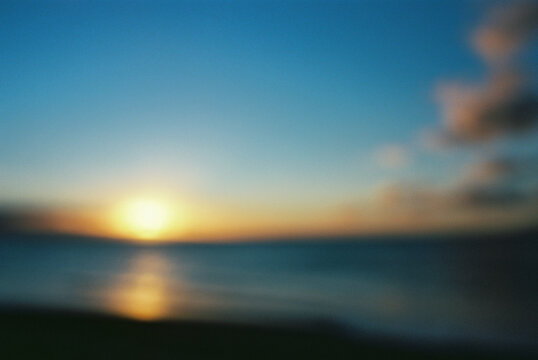 Blurry sunset over ocean