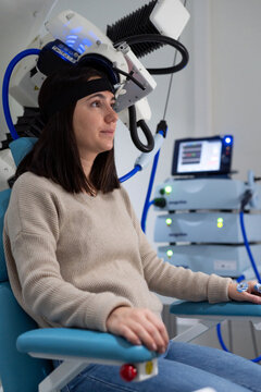 Woman patient receiving TMS procedure