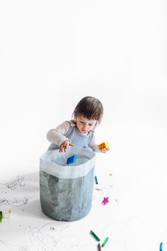 Little Girl Playing with Dices