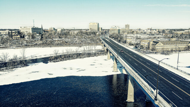 Snow covers landscape into the city