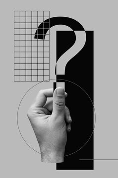 Male Hand Holds Question Mark