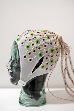 EEG cap on green mannequin head