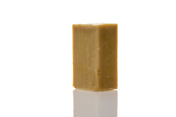 a piece of household soap of 72 percent fat content, highlighted on a white background