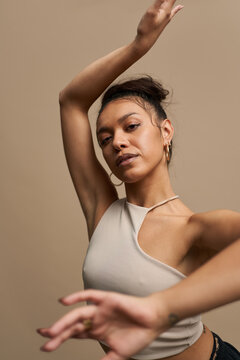 Hispanic female dancer looking at camera