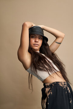Trendy Hispanic female bending back