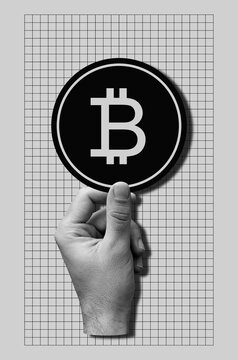 Hand holding bitcoin