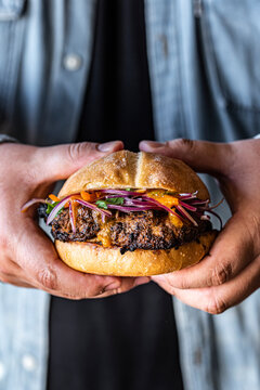 Man holding a Chicken Burger