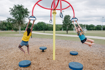 Black and caucasian girs spinning