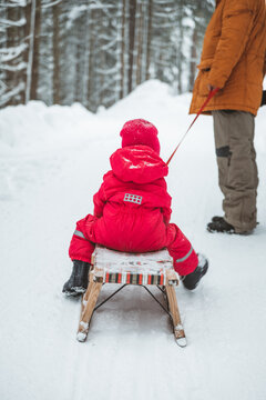 girl sitting on a sleigh