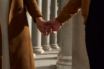Detail photo of the hands of a multiracial couple