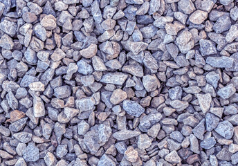 Smooth round pebbles texture background. Pebble sea beach close-up, dark wet pebble and gray dry pebble. High quality photo