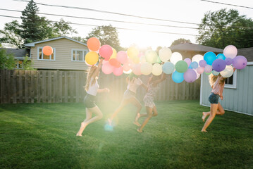 Diverse teens with balloons