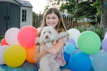 Girl holding puppy