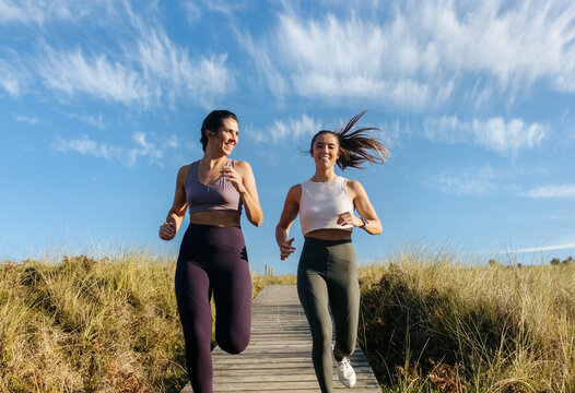 Two young fitness women training